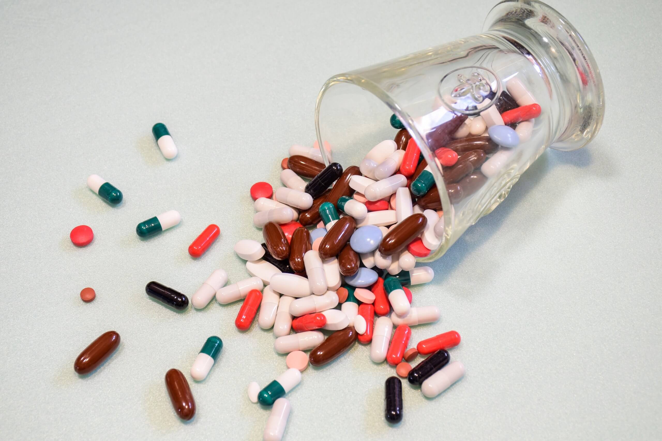 Many,Drugs,And,Pills,Spilled,Out,Of,A,Glass,On
